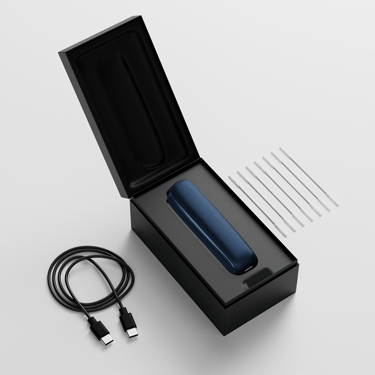 Ploom AURA open box showing the device, its charging cable and cleaning sticks