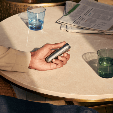 The sleek Ploom AURA Lunar Silver deviceis a discreet companion always with you
