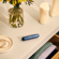Ploom AURA front panel Navy Blue Augmented Pattern accessory on device, located on a table