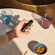 The Ploom AURA Jet Black is a sleek and convenient device easy to manipulate
