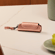 Ploom AURA Rose Gold Solo futrola na stolu