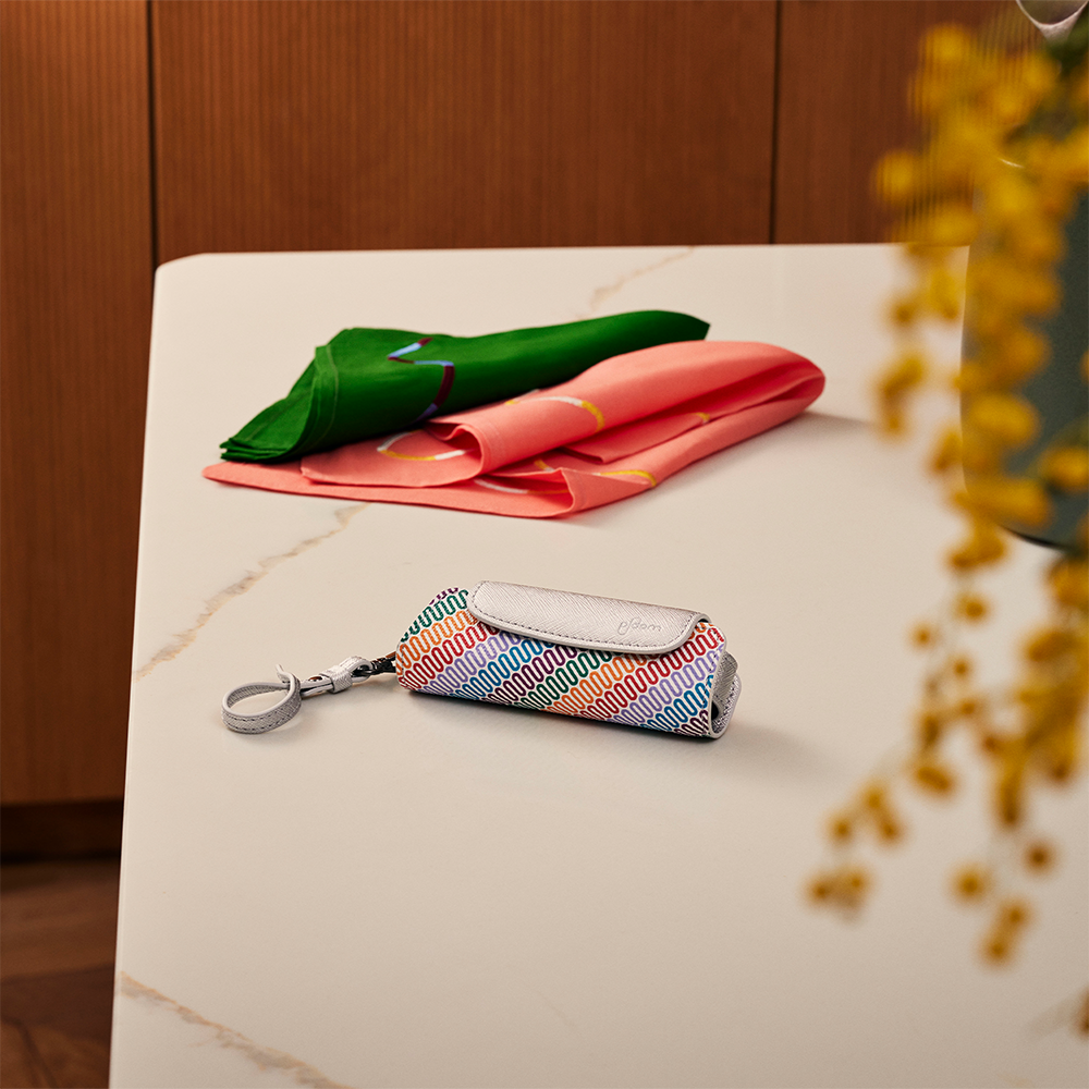 Ploom Aura Multicolored Patterned Canvas Solo Carry Case accessory on a table
